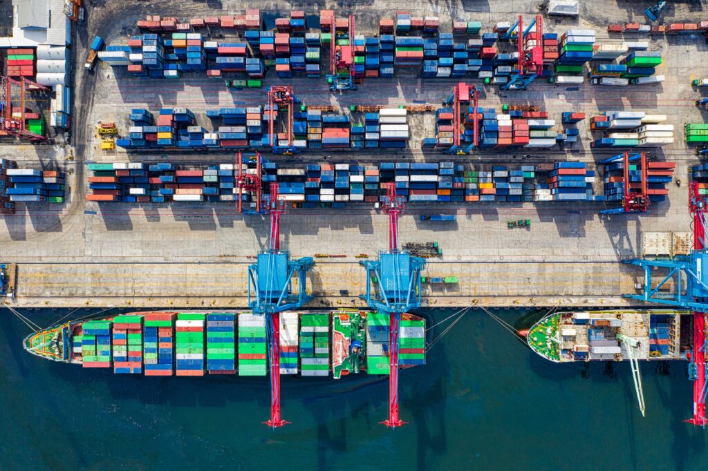 Bird's eye view of shipping containers and boat.